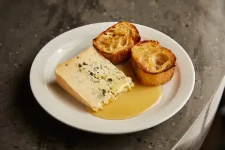 The ‘Frenchest of cheeses,’ with toasted baguette and a pool of hot honey, at Whyte’s, London E8.