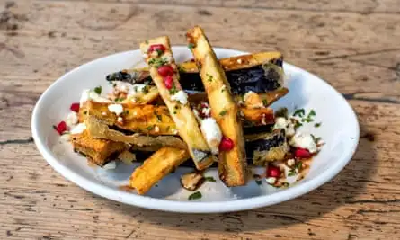 ‘Crisp-shelled fritters with an almost liquid centre. Or chips as we might prefer to call them’: aubergine fritters.