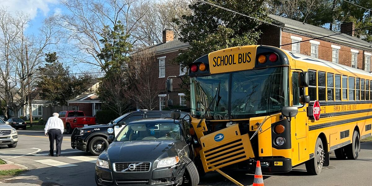 Car runs through stop sign, crashes into school bus in Franklin