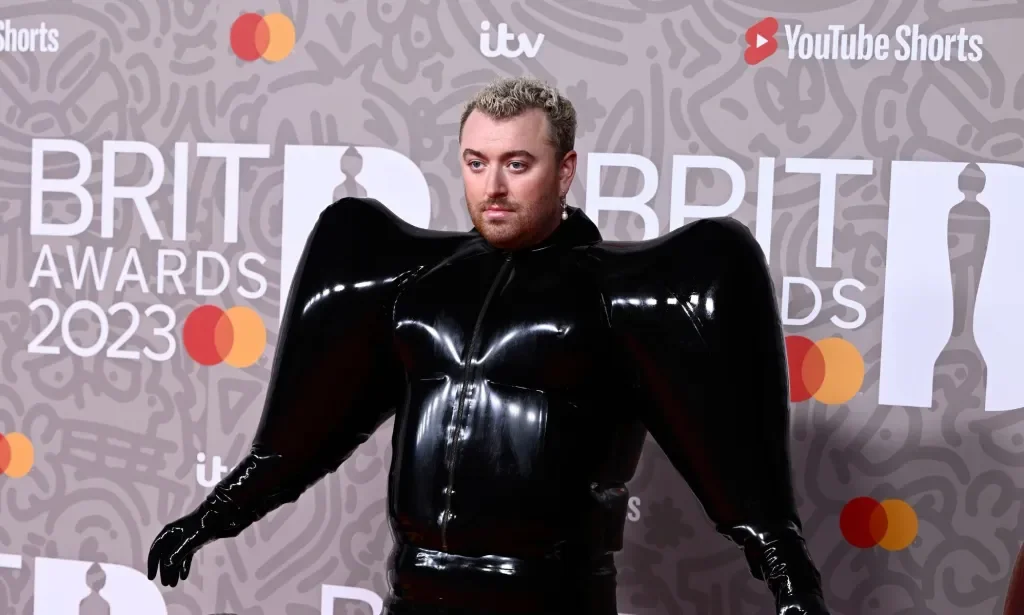 Sam Smith wearing a black Valentino latex suit on the Brit Awards red carpet.