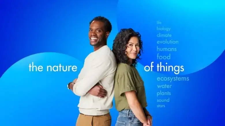 Two people smiling, on blue background, with text: The Nature of Things.