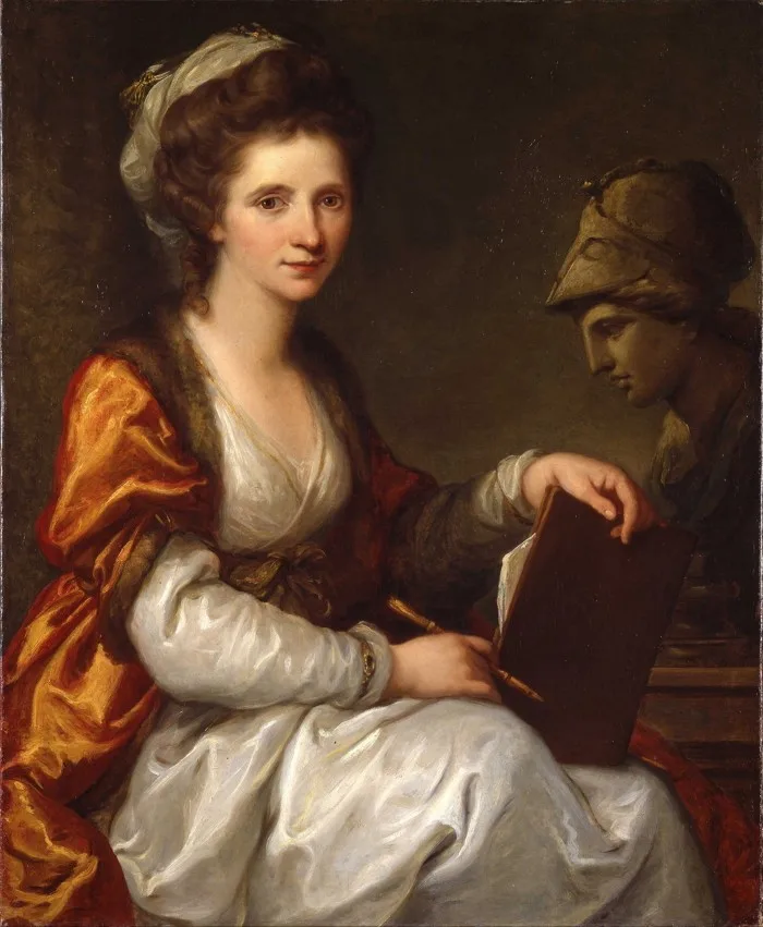 A woman sits on a chair