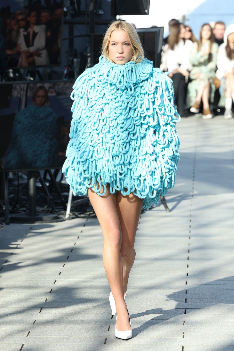 Lila Moss’s blue micro mini poncho dress is giving high-fashion Cookie Monster