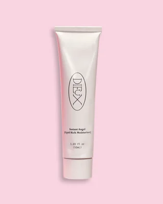 dieux moisturizer angel against a pink background