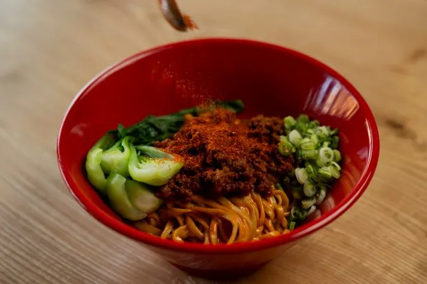 The soupless tantanmen, with added mala spice, at Akahoshi Ramen in Chicago on March 28, 2024. (Vincent Alban/Chicago Tribune)