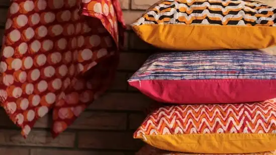 Cushions: Use colourful cushions to add a pop of colour to your living room or bedroom. Consider using traditional Islamic patterns or motifs for a festive touch. (Unsplash)
