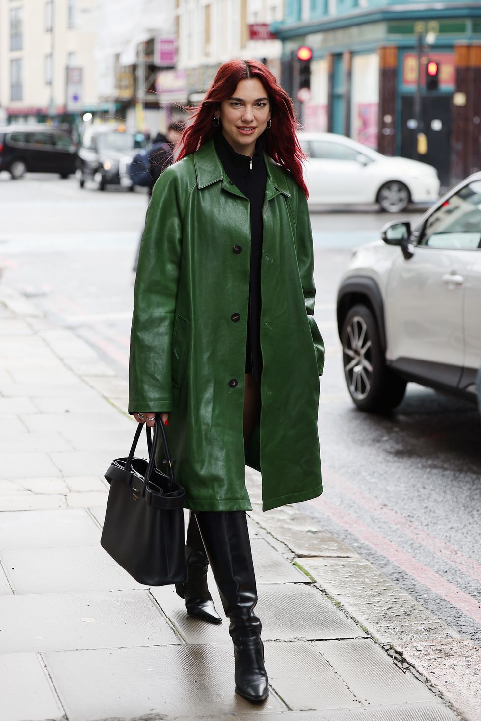 Dua Lipa makes the trouser-less trend work for a rainy day in London