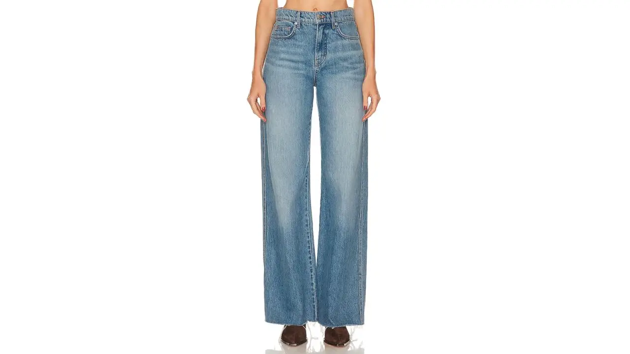 A person wearing Veronica Beard Taylor High Rise Wide Leg Jeans.