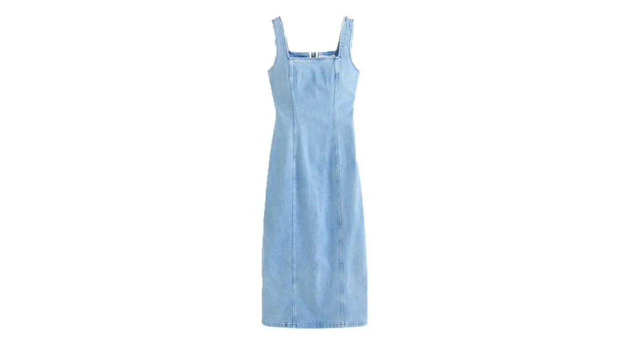 A denim dress on a white background.