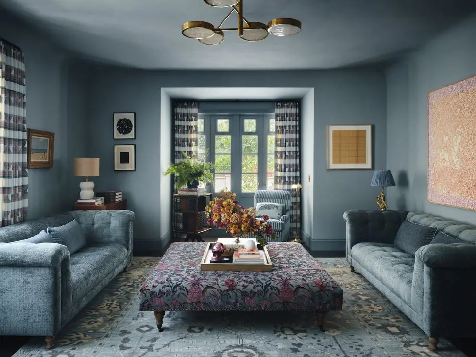 a living room with a chandelier and a couch