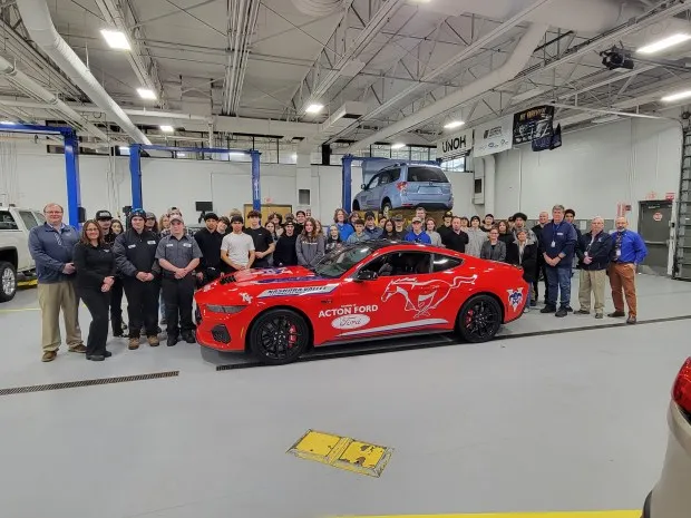 Students and staff from Nashoba Tech and representatives of Acton Ford show the 2024 Mustang GTO Acton Ford donated to the Automotive Technology program. (COURTESY NASHOBA TECH)