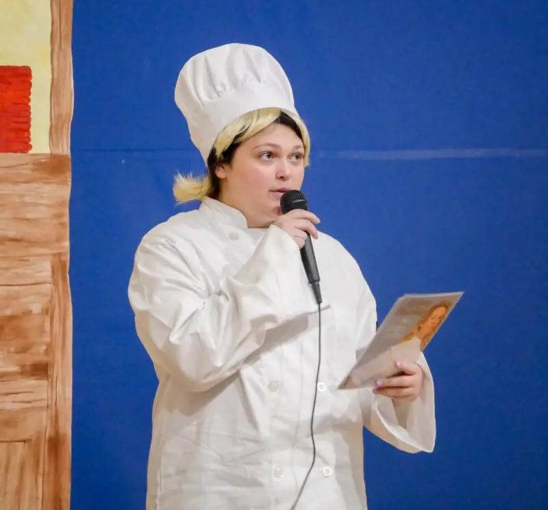 Saugus High School Senior Hannah Guzman portrays Helene Darraze at the 14th Annual Women in History highlighting female chefs and how they changed the world through their food and recipes on Monday in the Saugus High School gym presented by the American Association of University Women. 040824 Katherine Quezada/The Signal