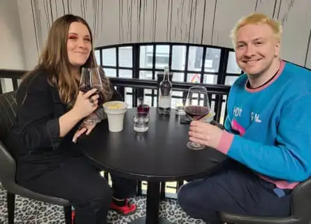 Kirsty and Joe at the restaurant holding wine glasses