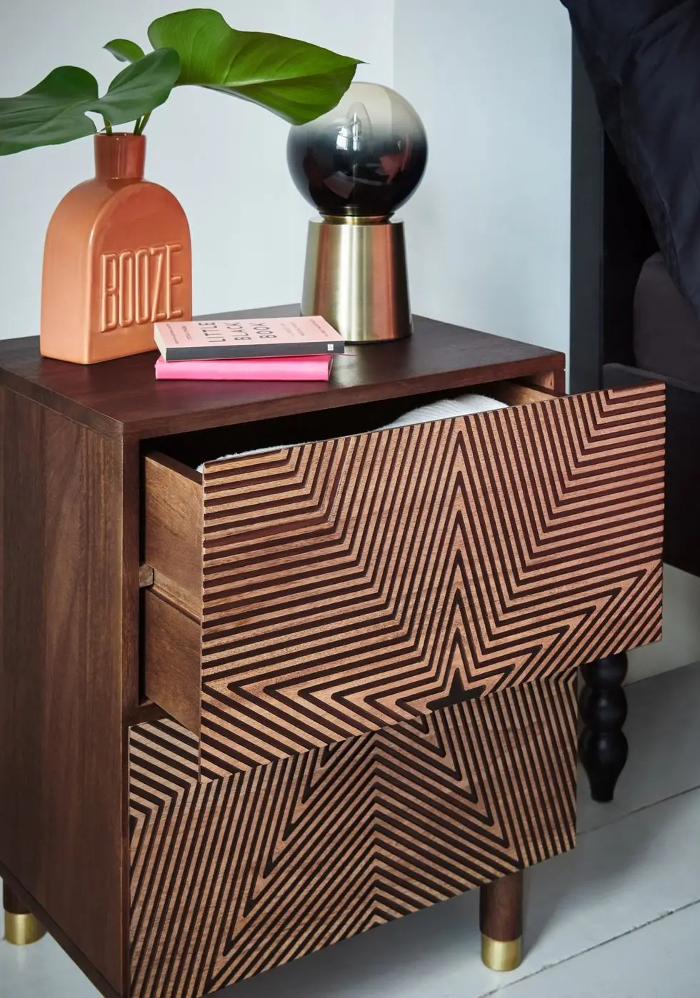 a table with books and a lamp