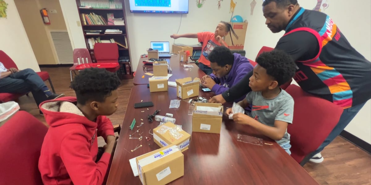 Engineers work to teach young men about the nuts and bolts of technology