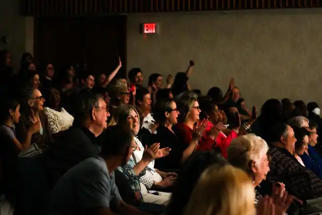 The audience cheers during Stephens College's 80th annual fashion show, “The Collections,” Saturday, April 13 at Windsor Auditorium in Columbia.