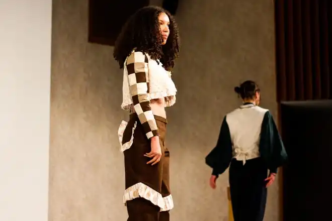 Arin Hawk wears a denim bralette with ruffle pants and a jacket set designed by Riley Pierson during Stephens College's 80th annual fashion show, “The Collections,” Saturday, April 13 at Windsor Auditorium Stephens College in Columbia.
