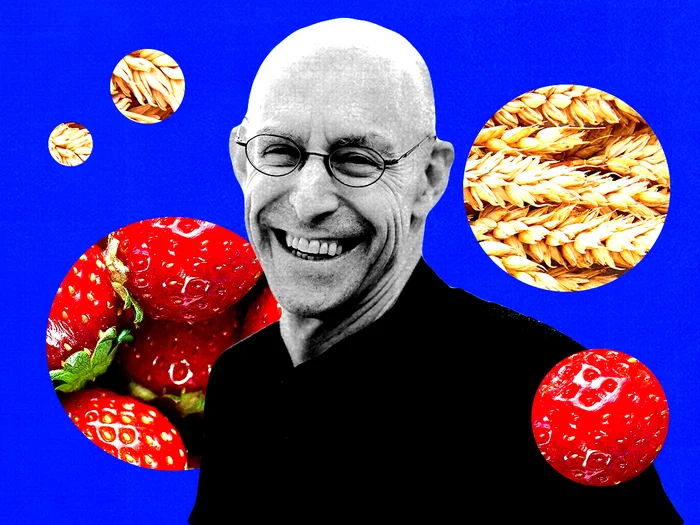 Michael Pollan in front of strawberries and wheat.