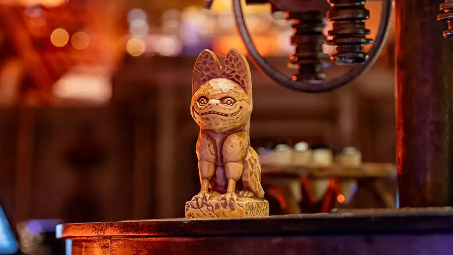 A Grinning Loth-cat Souvenir Mug sitting in Oga's Cantina.