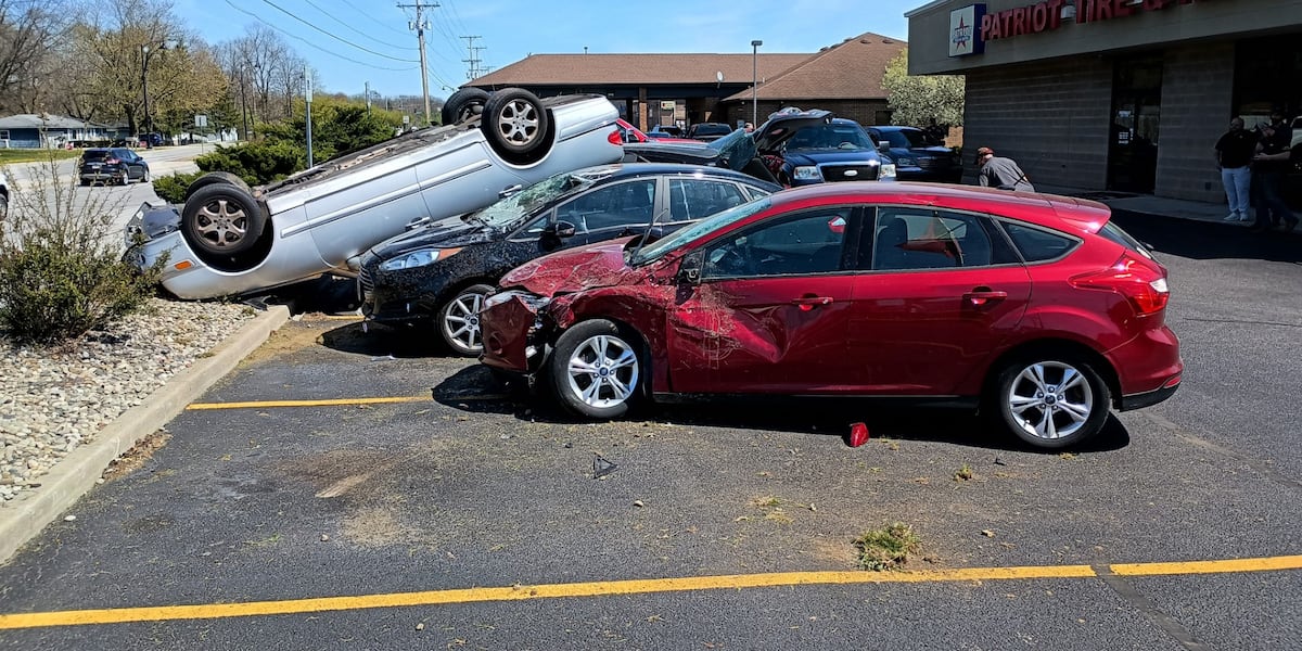 One hurt after car flips over, lands on parked vehicles at Patriot Tire