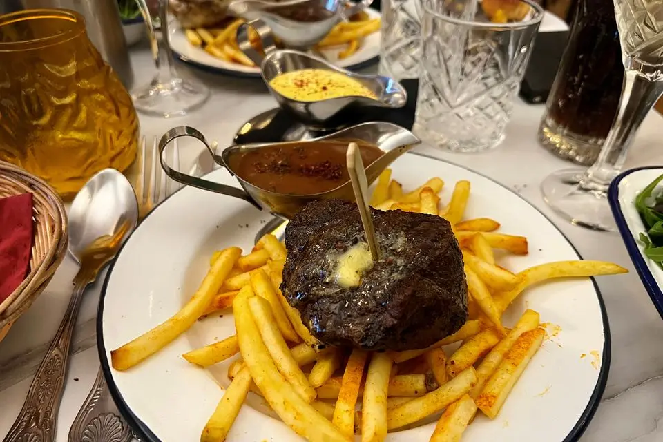 7oz fillet steak with frites, brandy peppercorn sauce and classic Bearnaise to the rear at Boeuf & Frites. Photo: Lucinda O'Sullivan