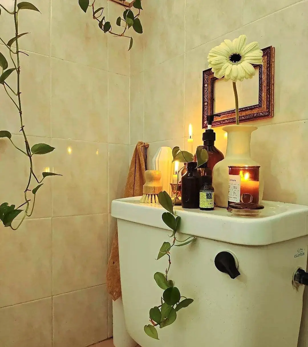 The bathroom exudes a calming and relaxing feel with scented candles.