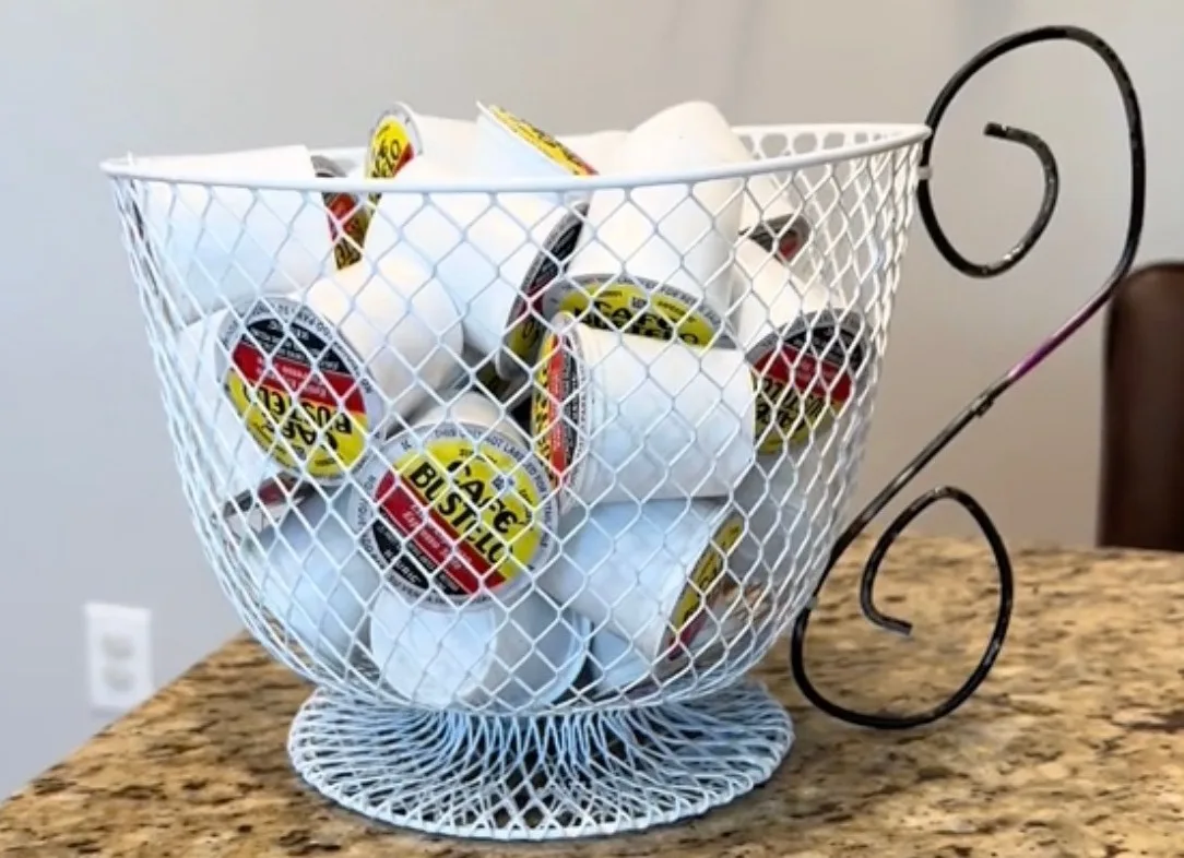 She used various pieces from Dollar tree to DIY a basket for her kitchen to hold K-cups