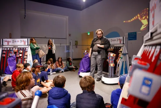 Brandon Mead, of Tech Interactive, teaches children about robotics during National AI Literacy Day at Tech Interactive in San Jose, Calif., on Friday, April 19, 2024. (Shae Hammond/Bay Area News Group)