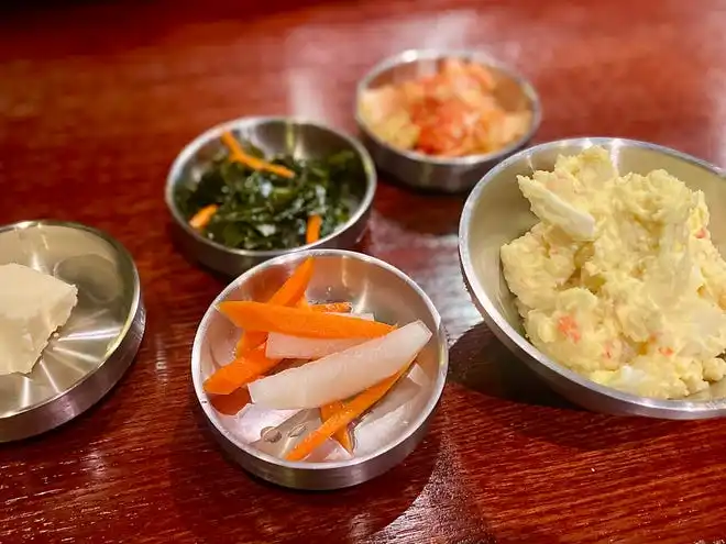 Potato and egg salad, sweet and sour seaweed and kimchi, among other sides at Hanwoo Korean BBQ in Port Orange.