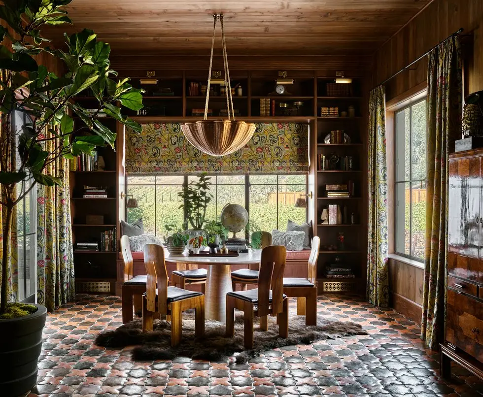 a dining room with a table and chairs