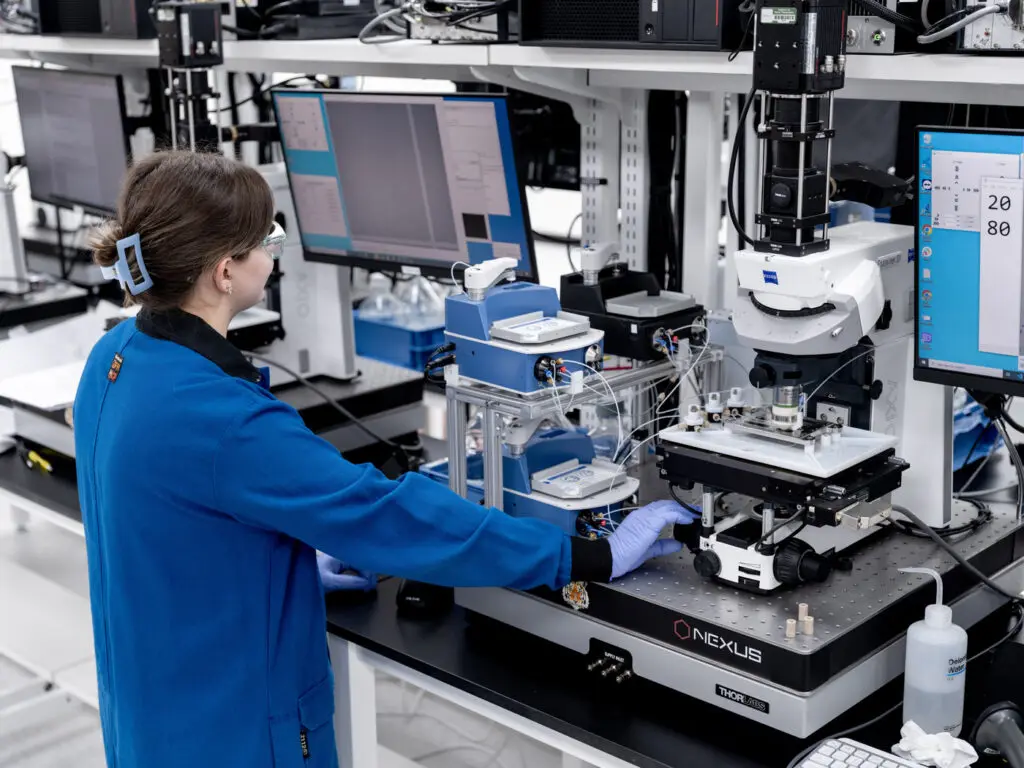 Female scientists works with a microscope in the laboratory.