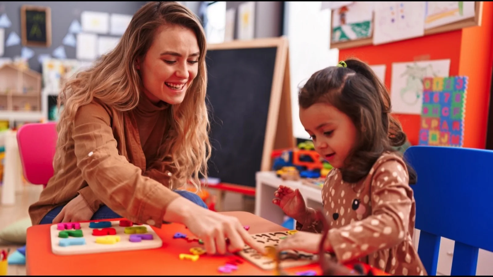 Kid playing with teacher