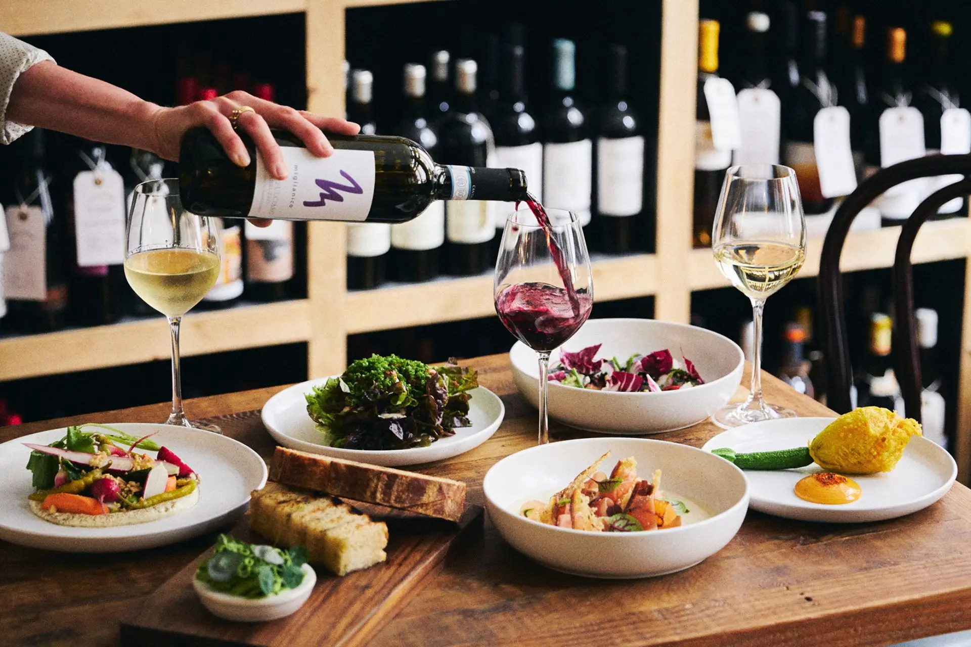 Table at Wilding, Oxford, with sharing plates and glasses of wine.