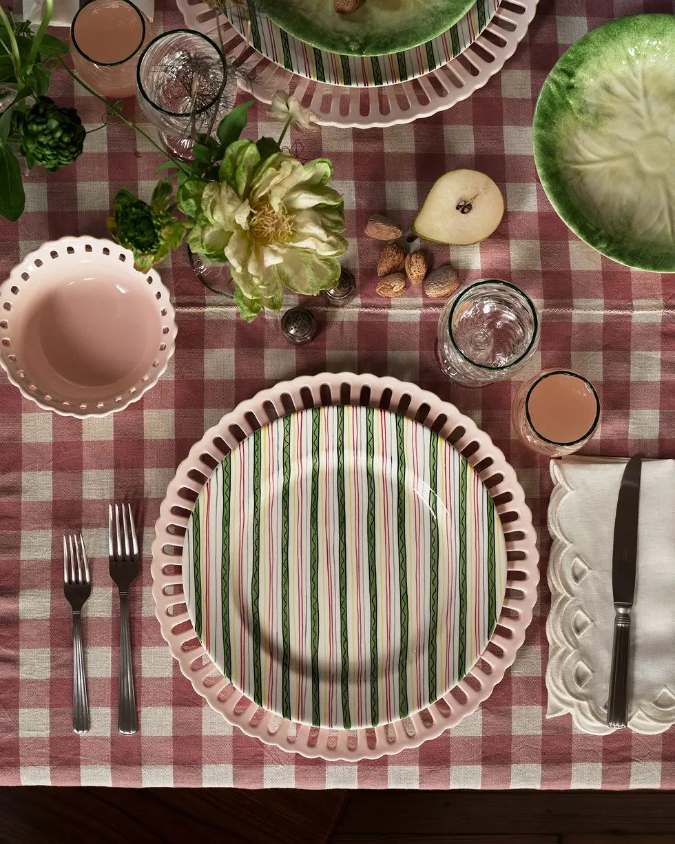 a table with plates and silverware