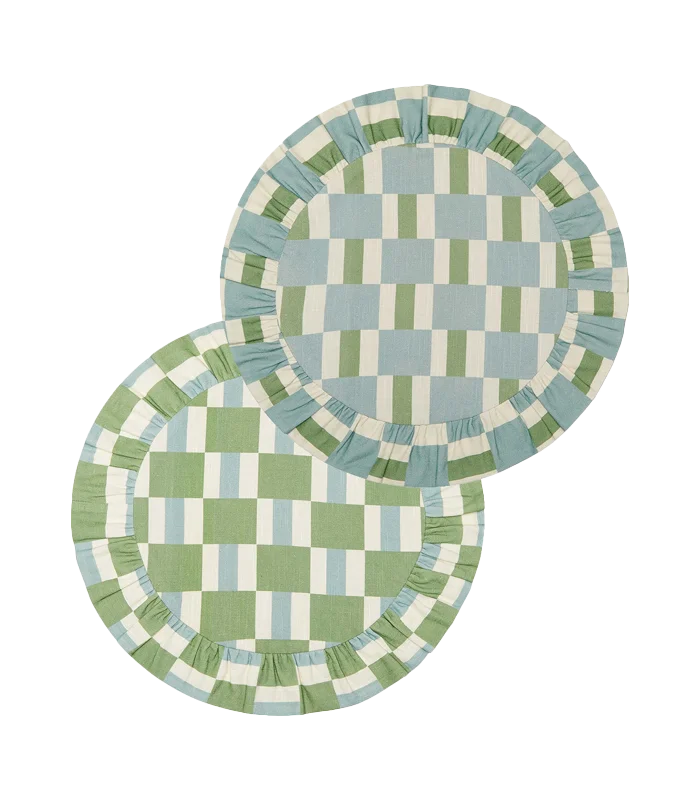 two round checkered placemats with ruffled borders