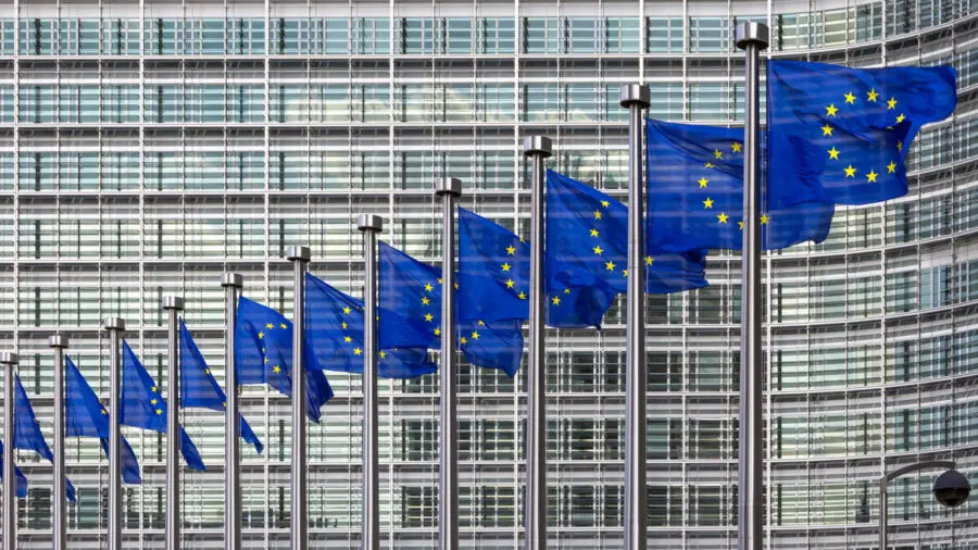 EU flags flying outside of the European Parliament in Brussels