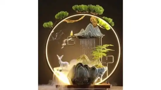 2. Nature's Embrace: Bringing the Outdoors In - Zen philosophy emphasizes a connection with the natural world. Incorporate natural materials like wood, stone, and bamboo into your design. Incorporating exposed wooden beams overhead, with their warm tones and natural textures creates a sense of groundedness. Consider incorporating pebble-lined walkways in your courtyard or a simple stone slab coffee table in your living room. These elements bring the serenity of nature indoors. Large windows that frame a view of lush greenery or strategically placed artwork depicting nature scenes can further connect you with the outdoors. Even a small indoor water feature, like a tabletop fountain, can bring the soothing sound of trickling water into your space.(Photo by Pinterest)