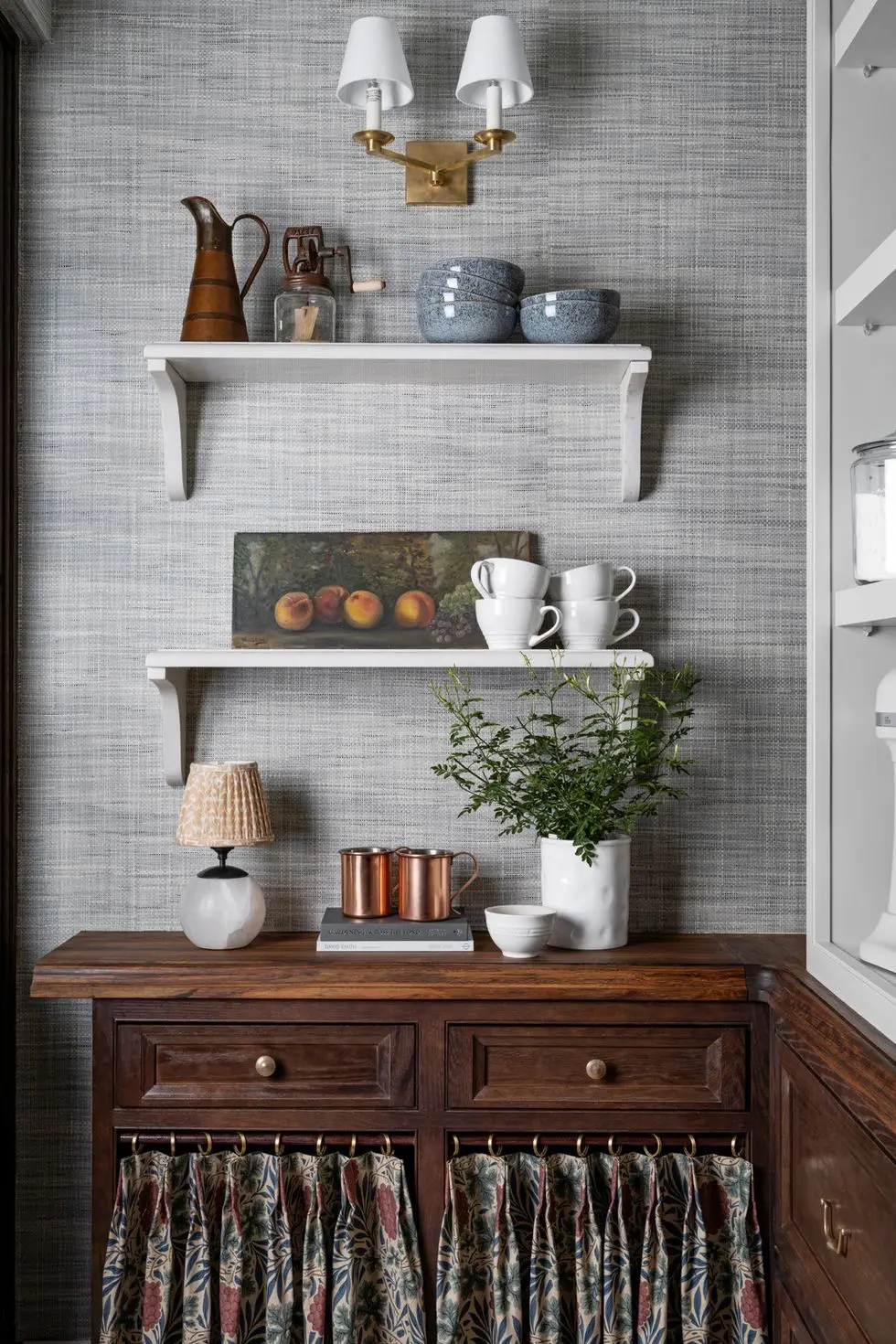 stocked shelves across from the scullery, a walk in pantry keeps small appliances and kitchenware from wayfair within reach fixed lower shelves are paneled with caesarstone, while upper shelves are adjustable