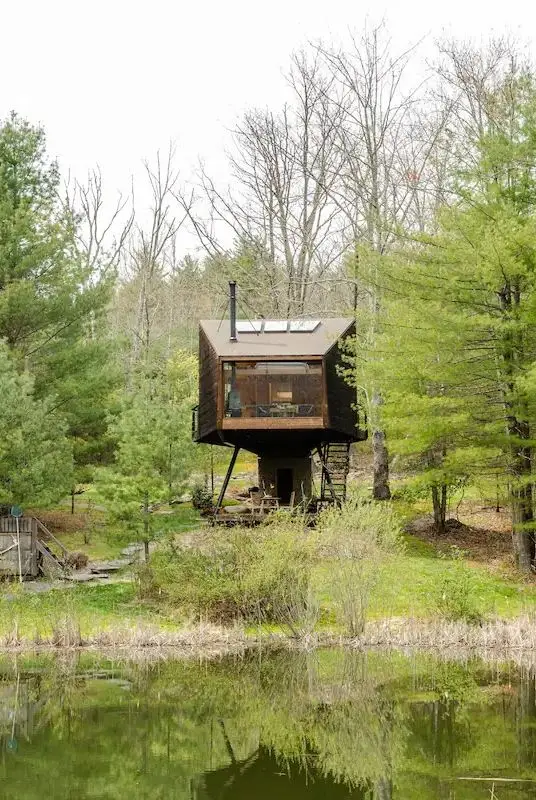 a small building in a forest