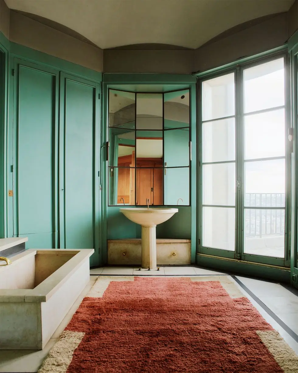 a bathroom with a large mirror