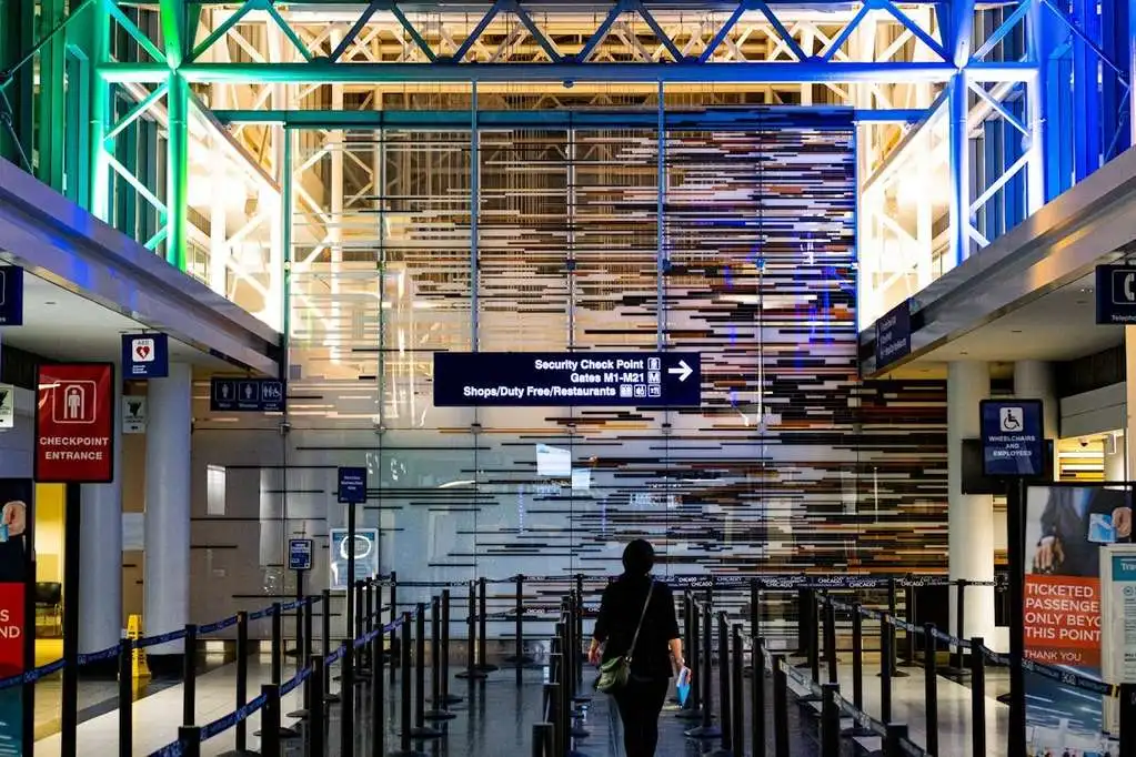 Interior of airport terminal departures area.