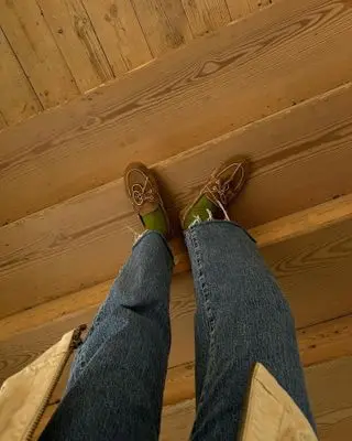 Influencer wears boat shoes.