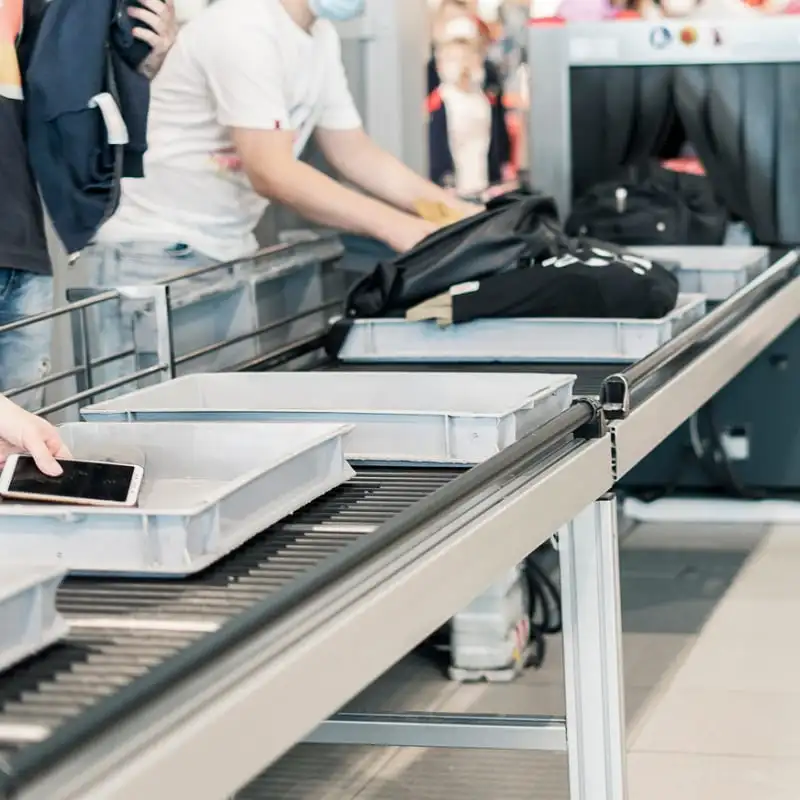 Travelers' belongings at airport security checkpoint