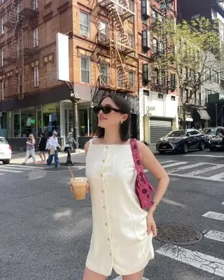 @ariannabaq outfit pic with Staud beaded bag.