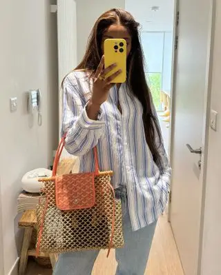 @mimi.orere outfit selfie with Goyard net bag