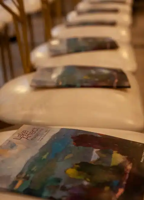 Lake Effect magazines are placed on the chairs at the 2024 Fashion Week of Rochester on May 17, 2024.