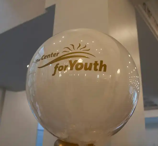A Center for Youth balloon is used a decor at the 2024 Fashion Week of Rochester on May 17, 2024.