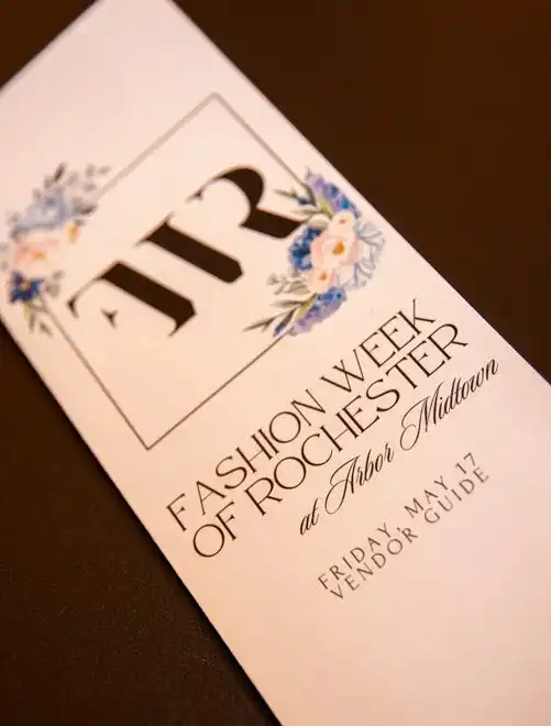 A 2024 Fashion Week of Rochester flyer is seen on a table on May 17, 2024.