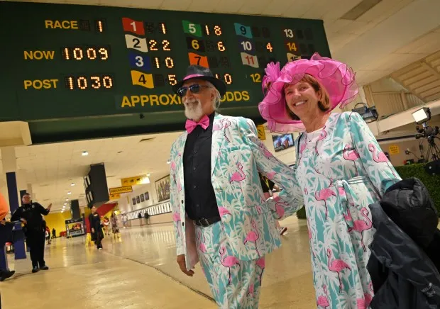 Les Ratekin and his wife, Dianne Schade of Colorado, taking in a day at Pimlico for the first time. The 2024 Preakness at Pimlico Race Course Saturday. (Lloyd Fox/Staff)