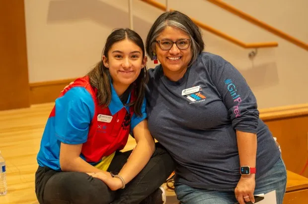 Senior Lily Downing, left, poses with her mom, St. Vrain competitive Robotics Program Manager Alexandra Downing, at a competition.(Courtesy photo)